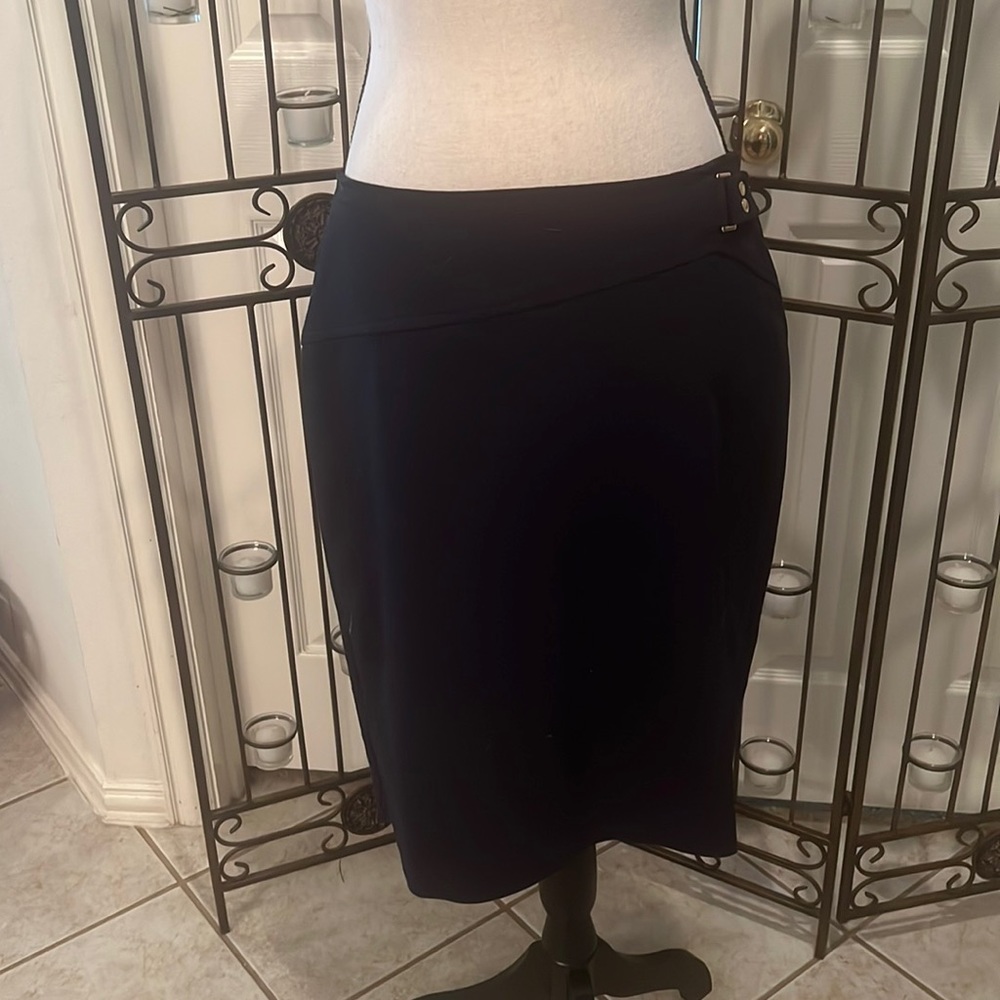 Navy above-the/knee skirt.